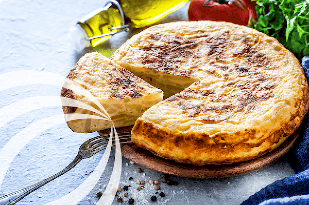 Spanish tortilla - admittedly not the one we created because my food photography isn't up to the job! Thank you Canva.